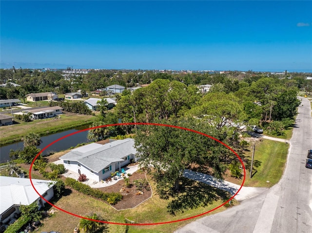 1691 Lakeview Pl, Englewood, FL 34223 - drone / aerial view of a large body of water and a tree filled landscape