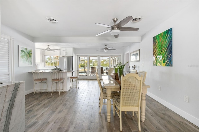 2060 Oyster Creek Dr, Englewood, FL 34224 - dining area with wood finished floors, baseboards, and a ceiling fan