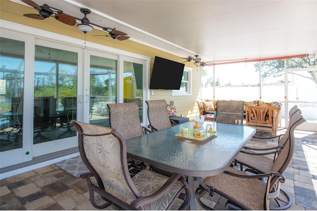 2060 Oyster Creek Dr, Englewood, FL 34224 - sunroom / solarium with french doors, a ceiling fan, outdoor dining area, and plenty of natural light