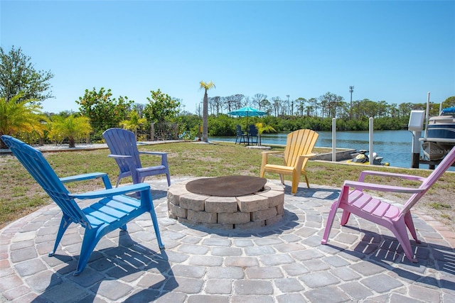 2060 Oyster Creek Dr, Englewood, FL 34224 - view of patio / terrace featuring an outdoor fire pit, a boat dock, and a water view