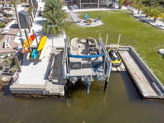 2060 Oyster Creek Dr, Englewood, FL 34224 - dock with boat lift, an outdoor fire pit, a yard, and a water view