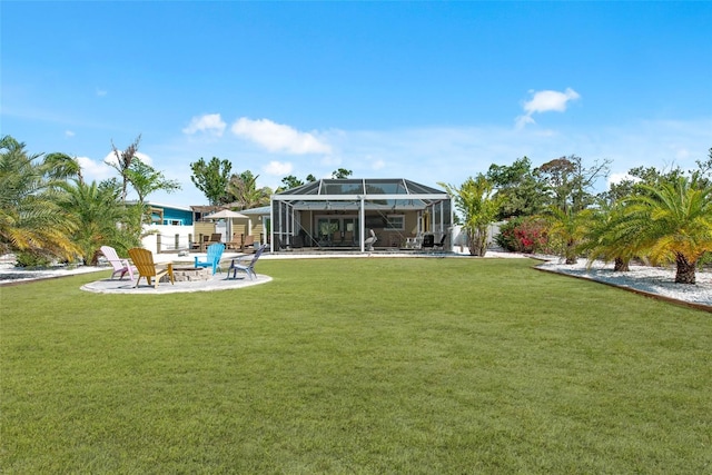 2060 Oyster Creek Dr, Englewood, FL 34224 - view of grassy yard with an outdoor fire pit, a lanai, and a patio