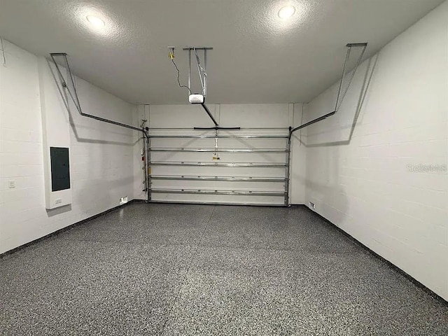 18043 Hillsborough Blvd, Port Charlotte, FL 33954 - garage with electric panel, a garage door opener, and concrete block wall