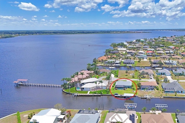 aerial perspective of suburban area with a large body of water