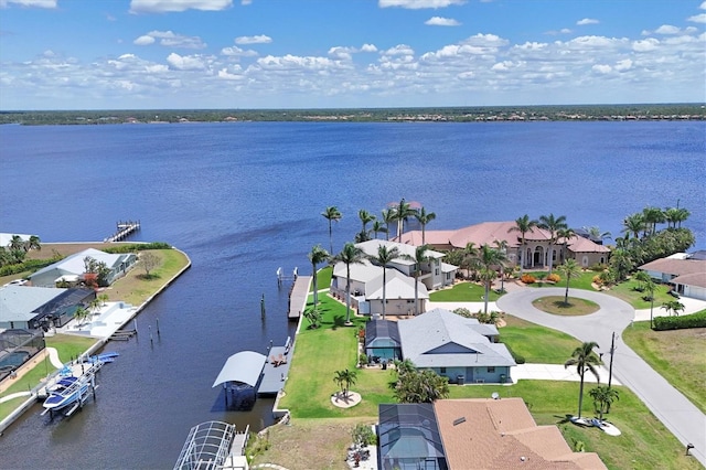aerial perspective of suburban area with a nearby body of water