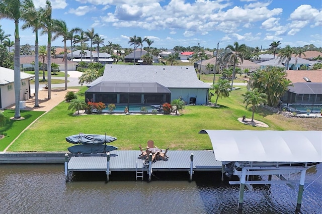 back of house featuring a residential view, a water view, an outdoor pool, glass enclosure, and a lawn