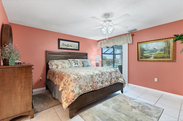 bedroom featuring a textured ceiling, tile patterned floors, ceiling fan, baseboards, and access to outside