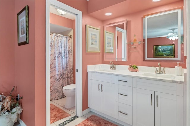 full bathroom with tile patterned floors, toilet, double vanity, a shower with shower curtain, and a ceiling fan