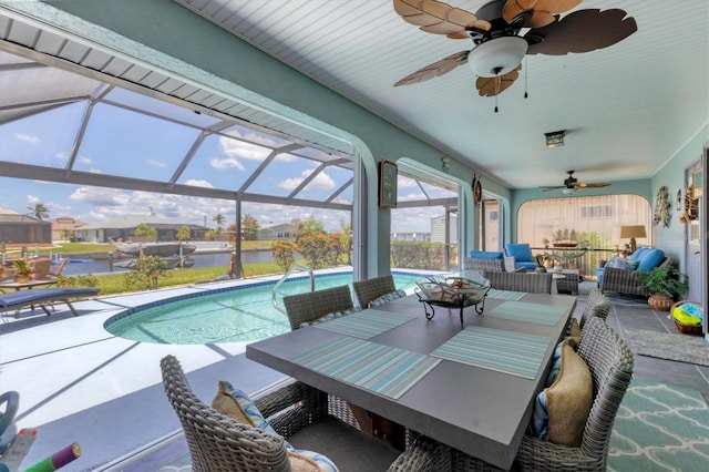 view of patio / terrace with ceiling fan, an outdoor living space, an outdoor pool, a lanai, and outdoor dining space