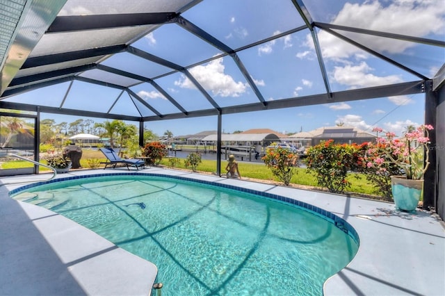 swimming pool featuring a patio, a residential view, and glass enclosure