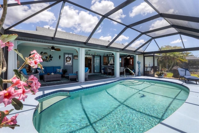 swimming pool with an outdoor hangout area, ceiling fan, a patio, and glass enclosure
