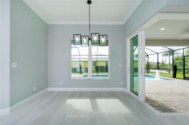 13344 Gershwin Ln, Port Charlotte, FL 33981 - unfurnished dining area featuring crown molding, wood finished floors, baseboards, and a sunroom