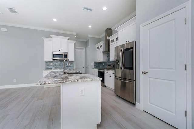13344 Gershwin Ln, Port Charlotte, FL 33981 - kitchen featuring appliances with stainless steel finishes, a sink, backsplash, light wood finished floors, and crown molding