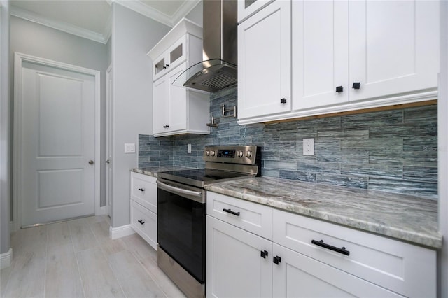 13344 Gershwin Ln, Port Charlotte, FL 33981 - kitchen featuring stainless steel electric range, wall chimney exhaust hood, ornamental molding, light stone countertops, and glass insert cabinets