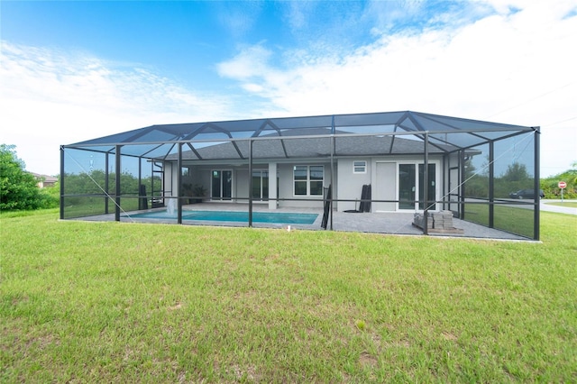 13344 Gershwin Ln, Port Charlotte, FL 33981 - rear view of house featuring a lawn, an outdoor pool, a patio area, and stucco siding