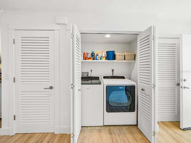 420 Gulf Blvd Unit 4, Boca Grande, FL 33921 - clothes washing area with washing machine and dryer, light wood finished floors, and recessed lighting