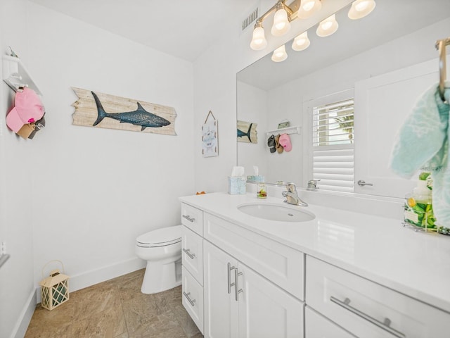 420 Gulf Blvd Unit 4, Boca Grande, FL 33921 - bathroom with baseboards, vanity, and toilet