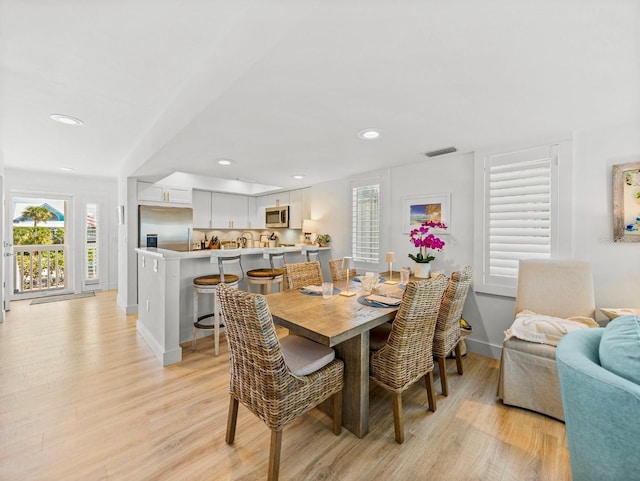 420 Gulf Blvd Unit 4, Boca Grande, FL 33921 - dining area with light wood-style floors, baseboards, and recessed lighting