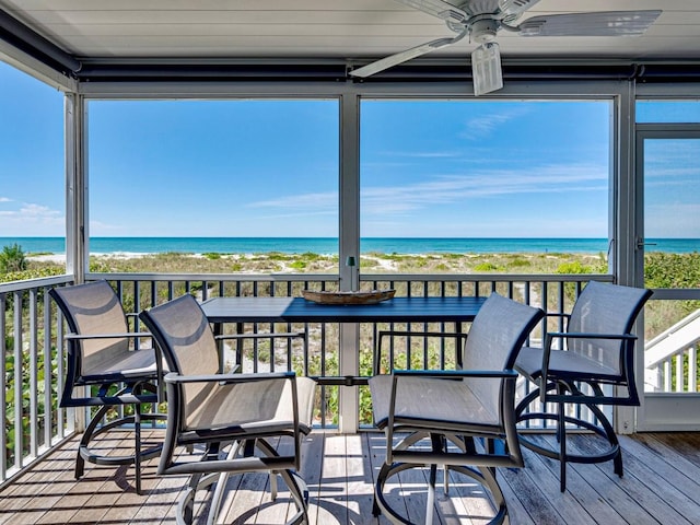 420 Gulf Blvd Unit 4, Boca Grande, FL 33921 - sunroom with view of water and beach, ceiling fan, and hardwood / wood-style flooring