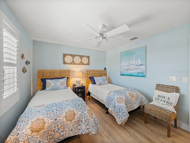 420 Gulf Blvd Unit 4, Boca Grande, FL 33921 - bedroom with wood finished floors and a ceiling fan