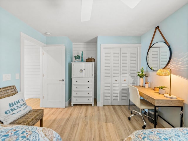 420 Gulf Blvd Unit 4, Boca Grande, FL 33921 - bedroom featuring light wood-style floors, a closet, an office area, and ceiling fan