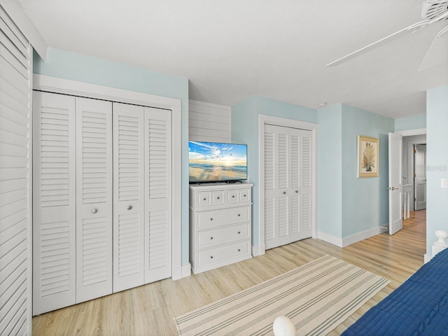 420 Gulf Blvd Unit 4, Boca Grande, FL 33921 - bedroom with multiple closets, light wood-type flooring, and baseboards