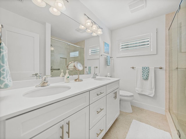 420 Gulf Blvd Unit 4, Boca Grande, FL 33921 - bathroom with a shower stall, double vanity, and toilet