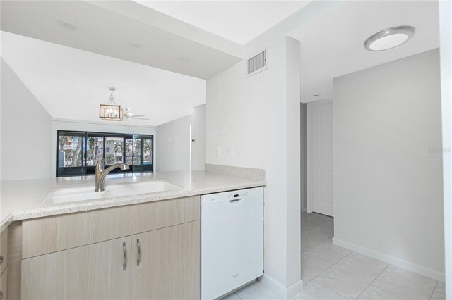1551 Beach Rd Unit 212, Englewood, FL 34223 - kitchen with white dishwasher, a sink, light brown cabinetry, a chandelier, and light tile patterned floors