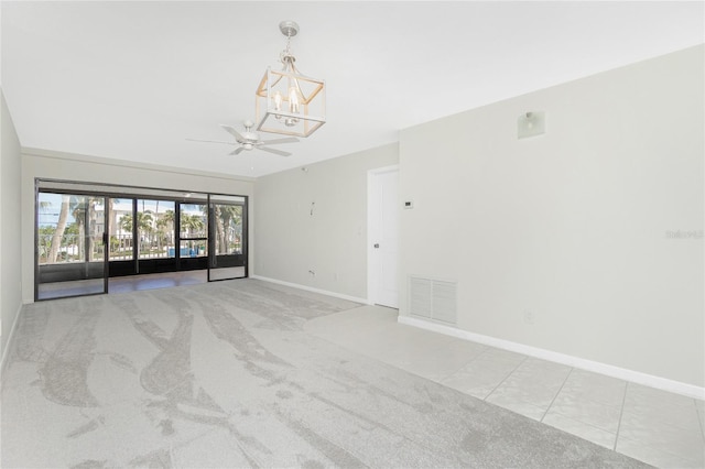 1551 Beach Rd Unit 212, Englewood, FL 34223 - carpeted spare room with a chandelier, baseboards, and a ceiling fan