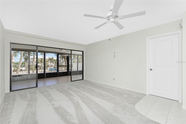 1551 Beach Rd Unit 212, Englewood, FL 34223 - carpeted spare room featuring ceiling fan and baseboards