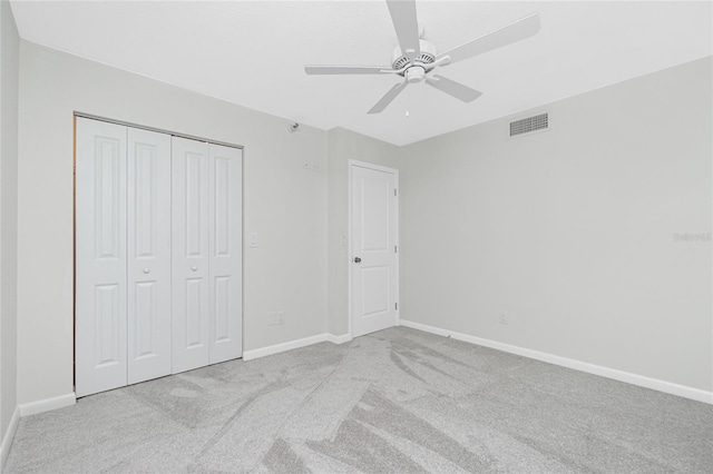 1551 Beach Rd Unit 212, Englewood, FL 34223 - unfurnished bedroom with carpet floors, baseboards, a closet, and ceiling fan
