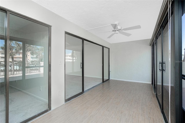1551 Beach Rd Unit 212, Englewood, FL 34223 - unfurnished sunroom featuring a ceiling fan