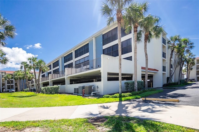 1551 Beach Rd Unit 212, Englewood, FL 34223 - view of apartment building / complex featuring central AC