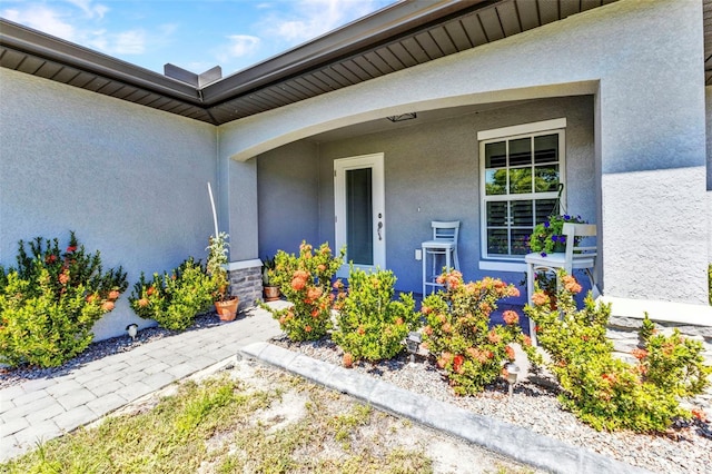 2678 Alva St, North Port, FL 34291 - entrance to property featuring stucco siding and a porch