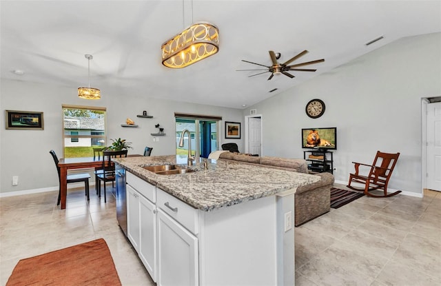 2678 Alva St, North Port, FL 34291 - kitchen with a sink, vaulted ceiling, stainless steel dishwasher, plenty of natural light, and a ceiling fan