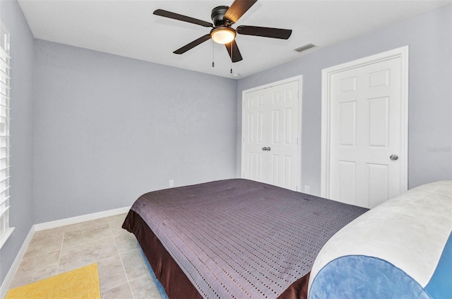 2678 Alva St, North Port, FL 34291 - bedroom featuring baseboards, a ceiling fan, a closet, and light tile patterned floors