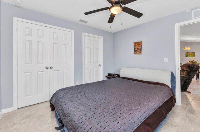 2678 Alva St, North Port, FL 34291 - bedroom featuring light tile patterned flooring, a closet, a ceiling fan, and baseboards