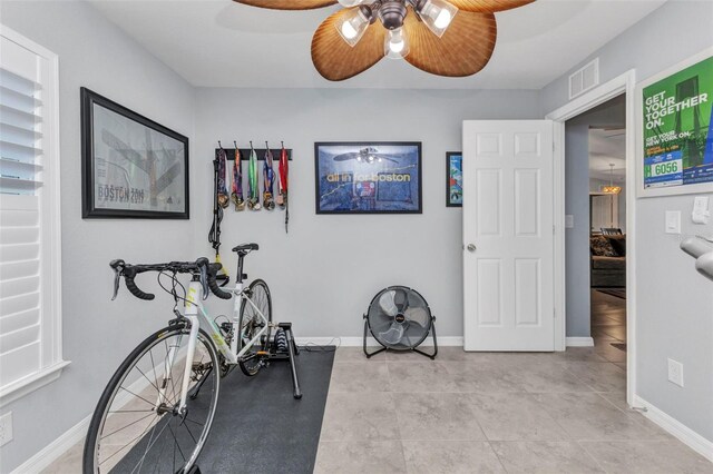 2678 Alva St, North Port, FL 34291 - workout area featuring ceiling fan and baseboards