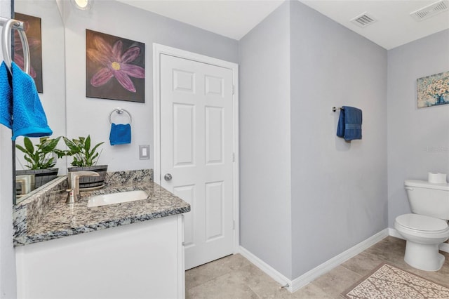 2678 Alva St, North Port, FL 34291 - bathroom with toilet, vanity, baseboards, and tile patterned floors