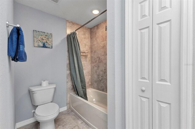2678 Alva St, North Port, FL 34291 - bathroom with a closet, baseboards, toilet, and shower / bath combo