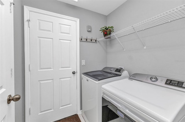 2678 Alva St, North Port, FL 34291 - clothes washing area with washer and dryer