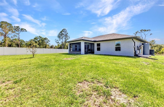 2678 Alva St, North Port, FL 34291 - back of property with central AC, stucco siding, and a sunroom