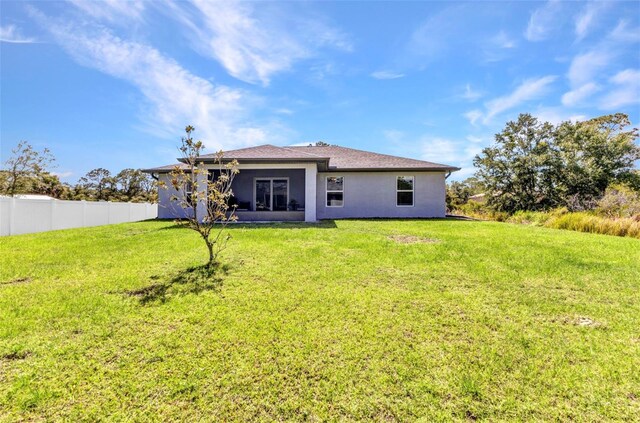 2678 Alva St, North Port, FL 34291 - rear view of house with stucco siding