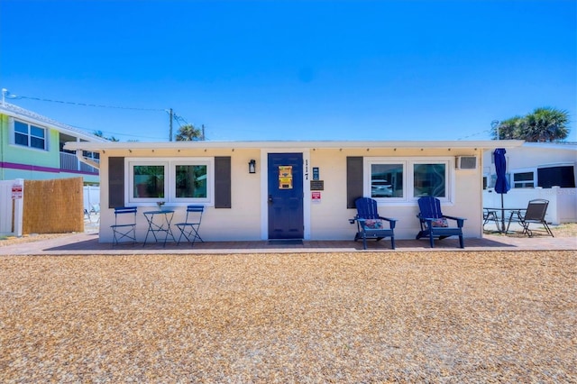 115 Friendship Ln, Englewood, FL 34223 - rear view of house featuring fence and a patio