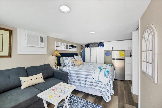 115 Friendship Ln, Englewood, FL 34223 - bedroom with freestanding refrigerator, dark wood finished floors, recessed lighting, and an AC wall unit