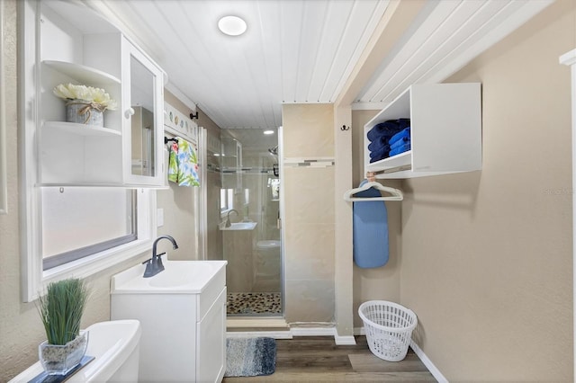 115 Friendship Ln, Englewood, FL 34223 - full bath featuring a shower stall, wood finished floors, and vanity