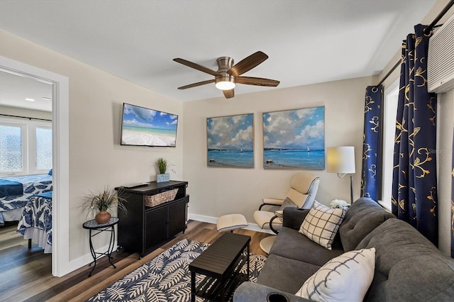 115 Friendship Ln, Englewood, FL 34223 - living area featuring dark wood-type flooring, a ceiling fan, and baseboards