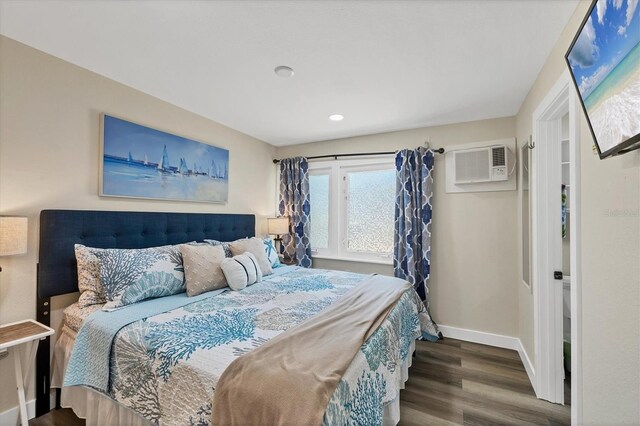 115 Friendship Ln, Englewood, FL 34223 - bedroom with a wall mounted air conditioner, wood finished floors, baseboards, and recessed lighting