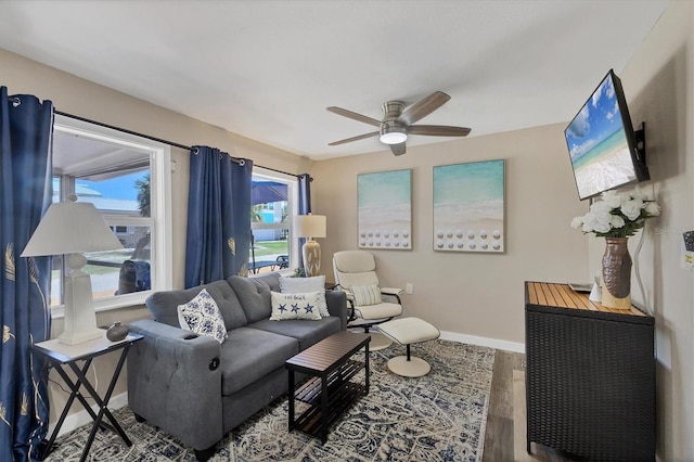 115 Friendship Ln, Englewood, FL 34223 - living area featuring wood finished floors, ceiling fan, and baseboards