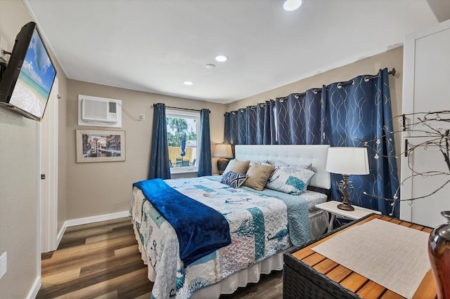 115 Friendship Ln, Englewood, FL 34223 - bedroom with wood finished floors, baseboards, a wall unit AC, and recessed lighting